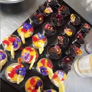 catering tray of decorated fruit cups